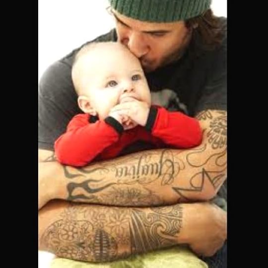 What's better than a man with a baby.? A tattooed man holding a baby!!!(: