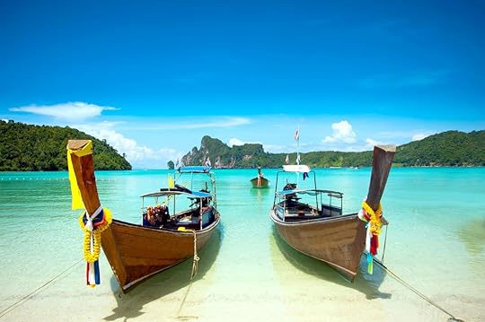 Clear waters of Phi Phi Island in Krabi Thailand with boats