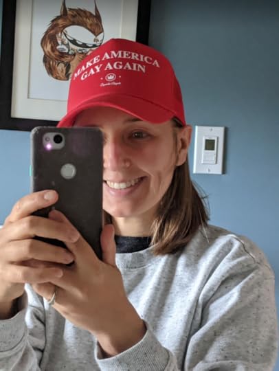 Author wearing red MAGA hat that says
