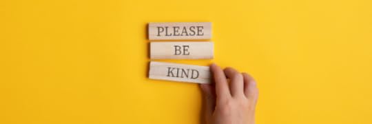 Yellow background with a hand arranging blocks that read,