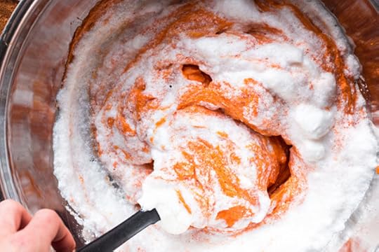 folding egg whites into sweet potatoes for sweet potato souffle recipe