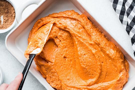 spreading sweet potatoes into baking dish