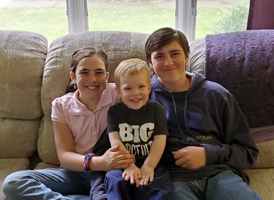 William, Adelaide, and Stafford. Stafford is wearing a Big Brother t-shirt.