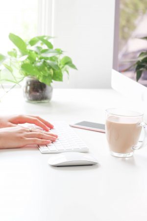 person typing on computer keyboard
