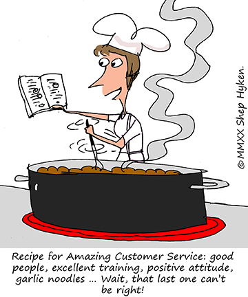 A chef reads her recipe book while stirring a giant pot