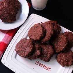 plate of chocolate oatmeal cookies on plate marked with sweet