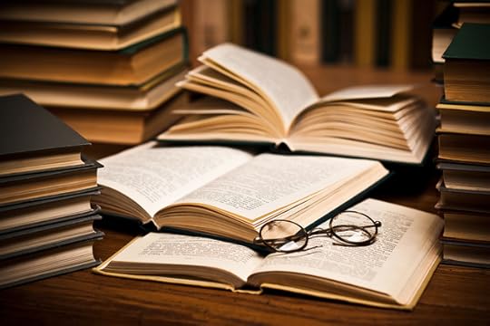 opened-book-lying-on-the-bookshelf-with-a-glasses