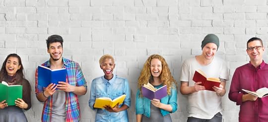 Diverse people holding books and smiling