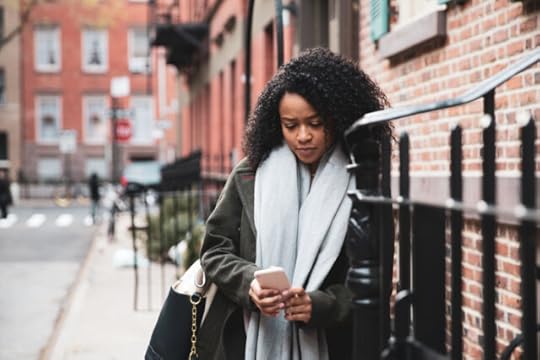 woman about to make a phone call to set boundaries with family around the holidays