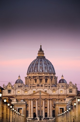 St Peter’s Basilica Rome around daybreak when the streetlamps are still lit and the dawn sky casts a soft pink glow over St Peter’s, with not a coach in sight. From Great Pilgrimage Sites of Europe. Photo copyright Derry Brabbs