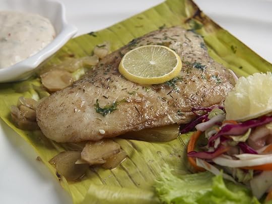 fijian fish lovo served in a white plate