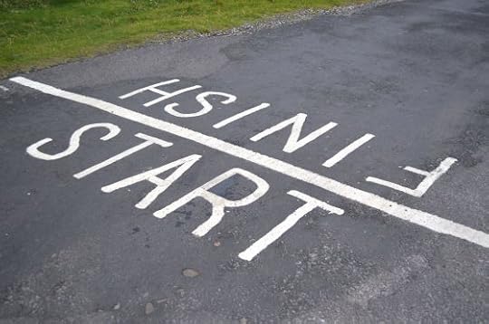 Image: start-finish line painted on a road for a foot race
