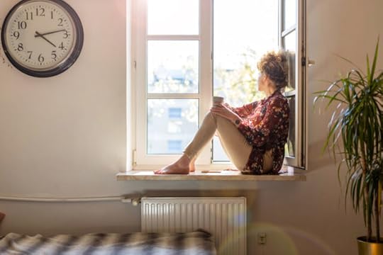 woman looking out the window