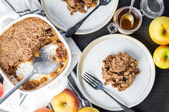 paleo grain free gluten free apple dump cake in a baking dish with a serving on a plate