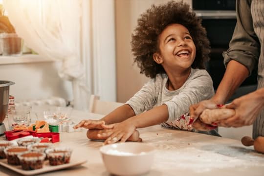 mom and daughter making christmas cookies together