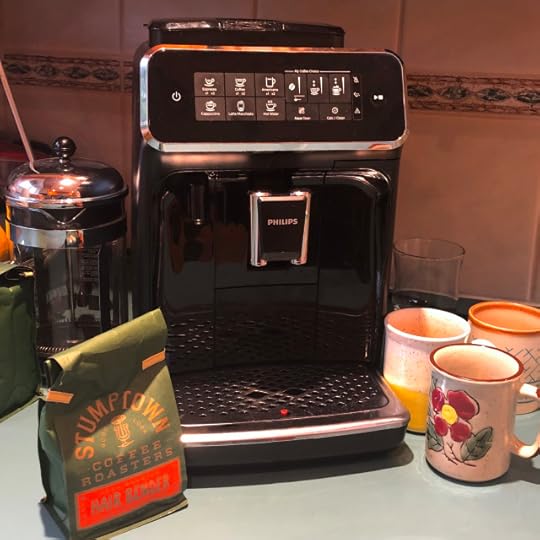 Photo of a super fancy espresso machine with beans and mugs
