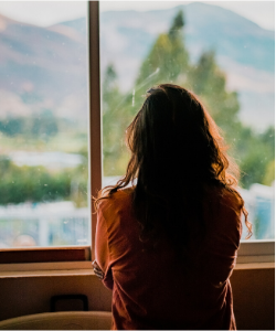 Isolation, woman at window