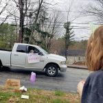 A car drops off a gift
