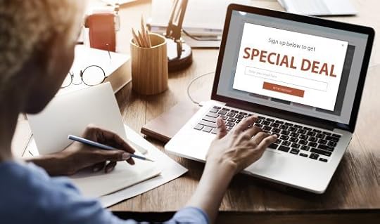 Image: woman at laptop with 'special deal' advertised on screen
