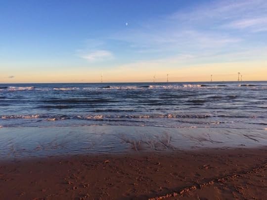walking on the beach: wind turbines