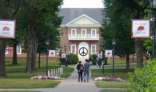 Guilford College with a peace sign