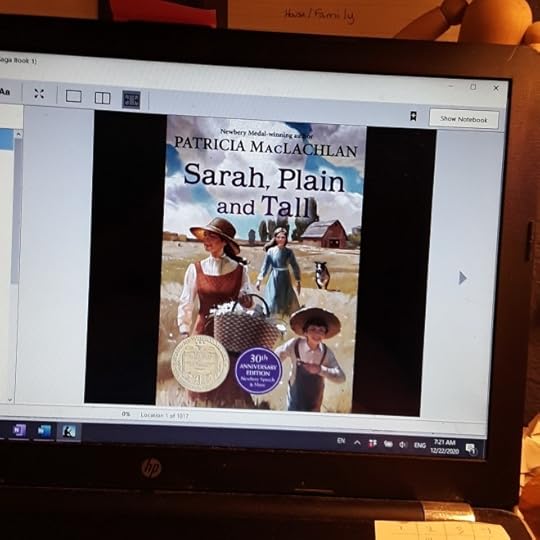 Sarah, Plain and Tall, by Patricia MacLachlan. This is a cover of the book on a computer screen.<br /><br />A woman in a large straw hat and brownish-red sleeveless dress over a white bouse holds a picnic basket. She leads an boy in a similarly wide-brimmed straw hat and overalls, a girl in a blue dress, and a dog, down a winding path through flat fields. There's a barn and silo in the background. 
