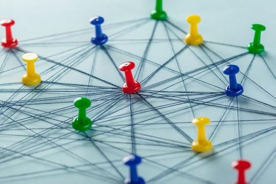 Image: a network of pushpins connected by string