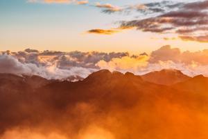 orange clouds over mountains