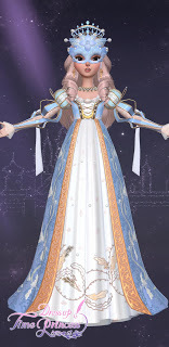 Romy in a baby blue and gold ballgown with a matching crown and masquerade mask