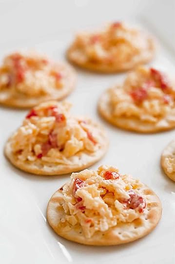Crackers topped with pimento cheese.