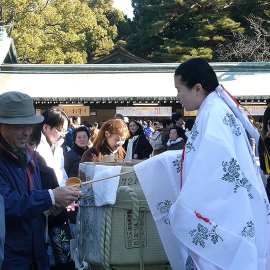 Shrine maiden serving new year's sake at the Meiji Shrine