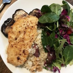 lemon chicken on plate of veggies