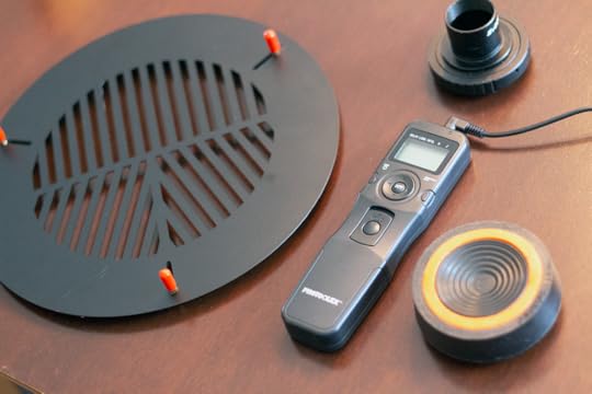 Left to right: 1) Bahtinov mask - placed over the telescope’s end, it produces a spiked diffraction pattern around a star that you can use to perfectly focus the telescope. You remove the mask afterwards. 2) Intervalometer - a programmable timer for your camera. You can set it up to take hundreds of exposures at a specified interval and duration. It plugs into the cable release on your camera. 3) Camera T-adapter - screws onto your camera like a lens. The narrow end is 1.25” and fits in your telescope like an eyepiece. Essentially, it changes your telescope into a giant camera lens 4) Anti-vibration pad - shock absorber placed under the legs of your mount. You’d be surprised how much your telescope picks up deck vibrations