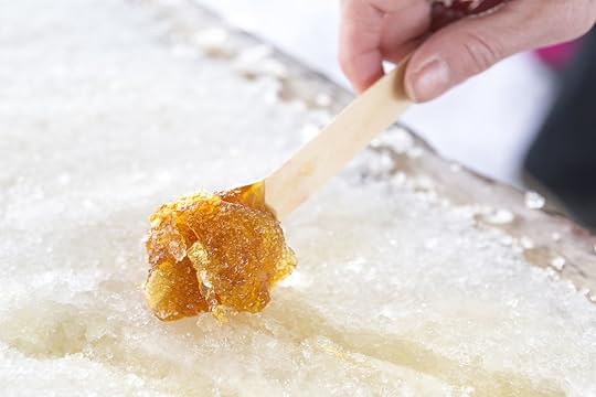 Maple taffy candle in snow