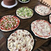 birthday cake and pizza on table