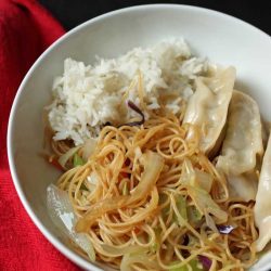 chow mein, rice, and potstickers in a bowl