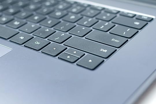 sentence fragments - modern laptop keyboard with comma on keys