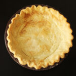 baked pie crust in brown pan