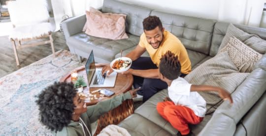 Family laughing together at home