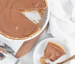 Chocolate Pie on a Board with a Served Piece on the Side