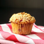 raspberry muffin on red checked cloth