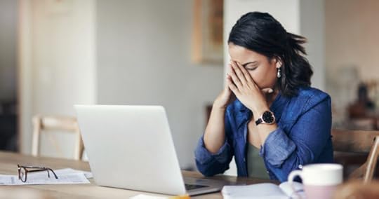 woman at her laptop showing signs of burnout