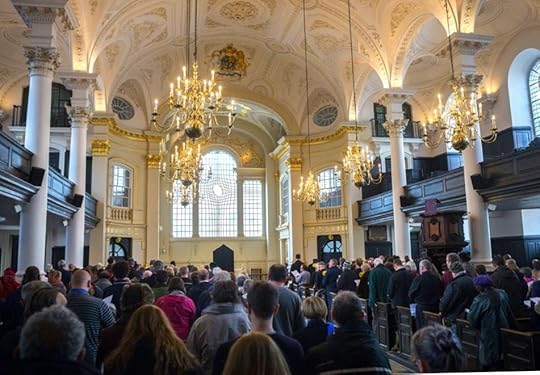 A large crowd of people in a churchDescription automatically generated with medium confidence