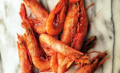 Pretty royal red shrimp, uncooked on a piece of marble.