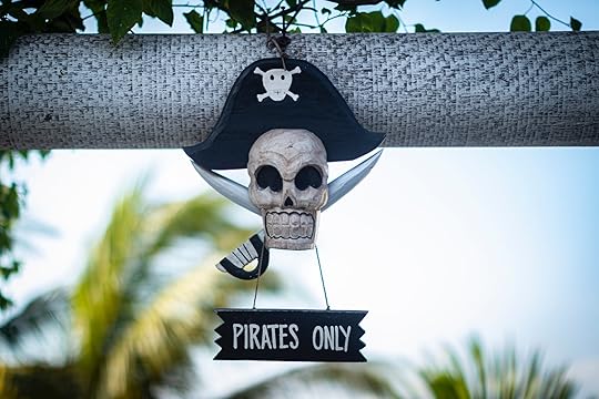 A decoration shaped like a skull in a pirate hat and crossed swords, with a sign that reads