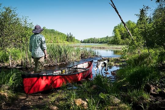 Person by a canoe