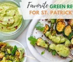 Bowl of colorful veggies with a small bowl of green avocado dressing