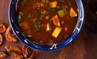 A bowl of caldo de camaron, Mexican shrimp soup