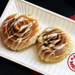 orange cinnamon rolls on platter