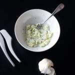 garlic butter in bowl with fork